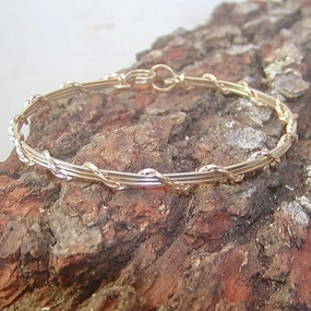Defining Piece Whimsical Accents 14kt Gold Filled 4-Strand Wire Wrapped Stackable Bracelet  SSSwa