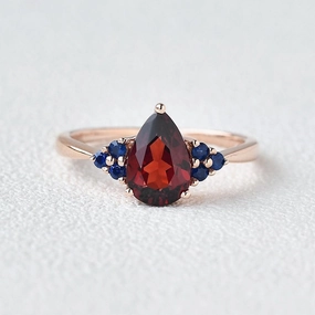 1.5ct Pear Shaped Garnet Rose Gold Ring Shimmering Accent