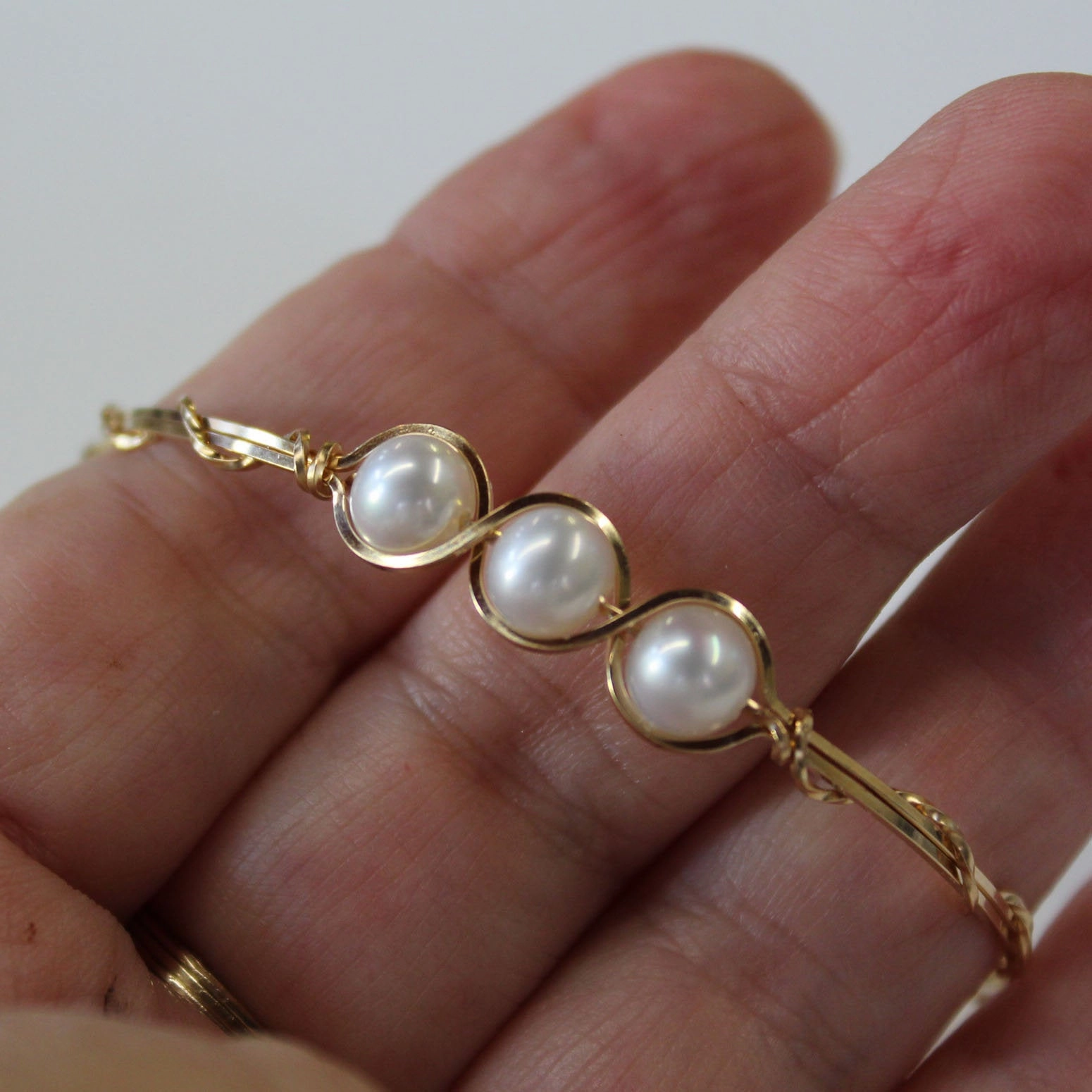 Quest Perspective Cross-Cultural Acceptance 3-Bead Outline Freshwater Pearls Gold Filled Wire Wrapped Bracelet