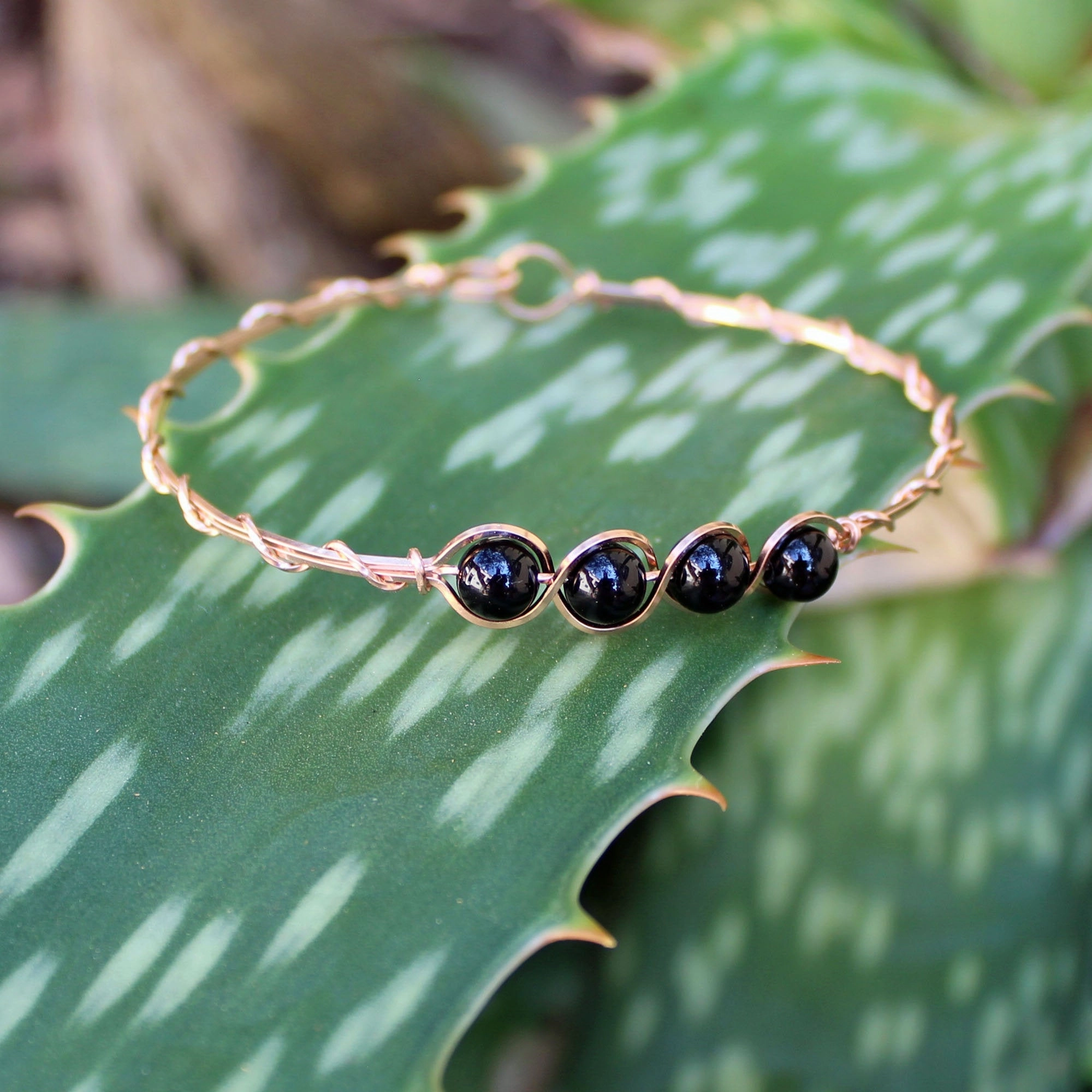 Common Thread Enduring Combinations 4-Bead Outline Black Onyx Beads Rose Gold Filled Wire Wrapped Bracelet