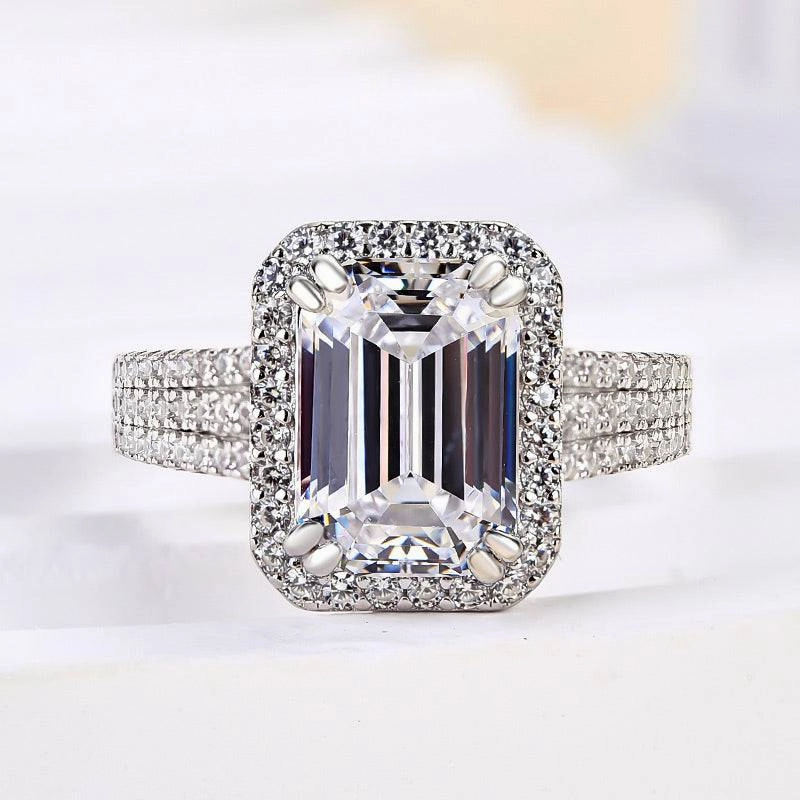 Quiet Look Louily Sparkle Halo Three Shank Emerald Cut Engagement Ring In Sterling Silver