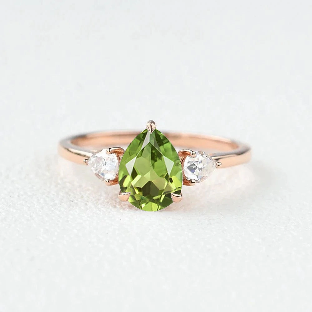 Graceful Elegance Muted Finish Pear Shaped Peridot Three Stones Ring