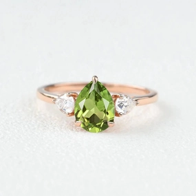 Graceful Elegance Muted Finish Pear Shaped Peridot Three Stones Ring